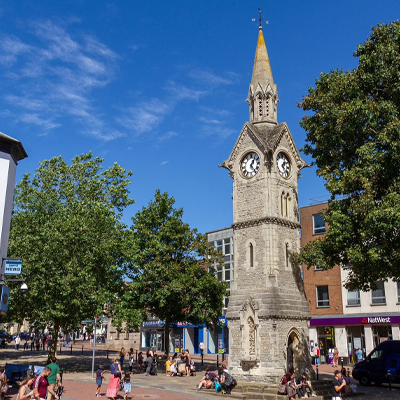 Aylesbury town centre featuring the historic clock tower and shopping area.